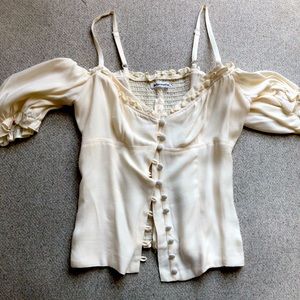 Blouse with a corset style zipper